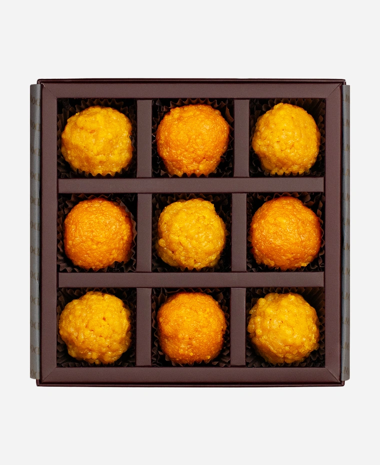 Classic Ladoo Selection gift box, 9 pieces, open: boondi and motichoor ladoo in a burgundy box with gold foil lettering.
