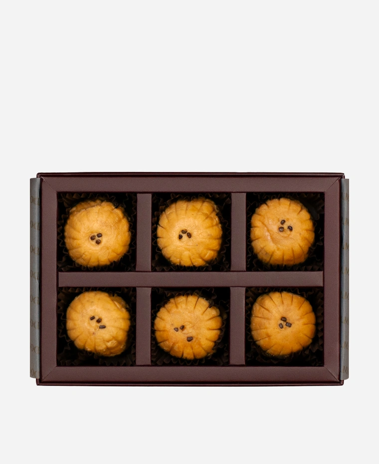 Mathura Peda gift box, 6 pieces, open: caramel-brown Mathura peda in a burgundy box with gold foil lettering.
