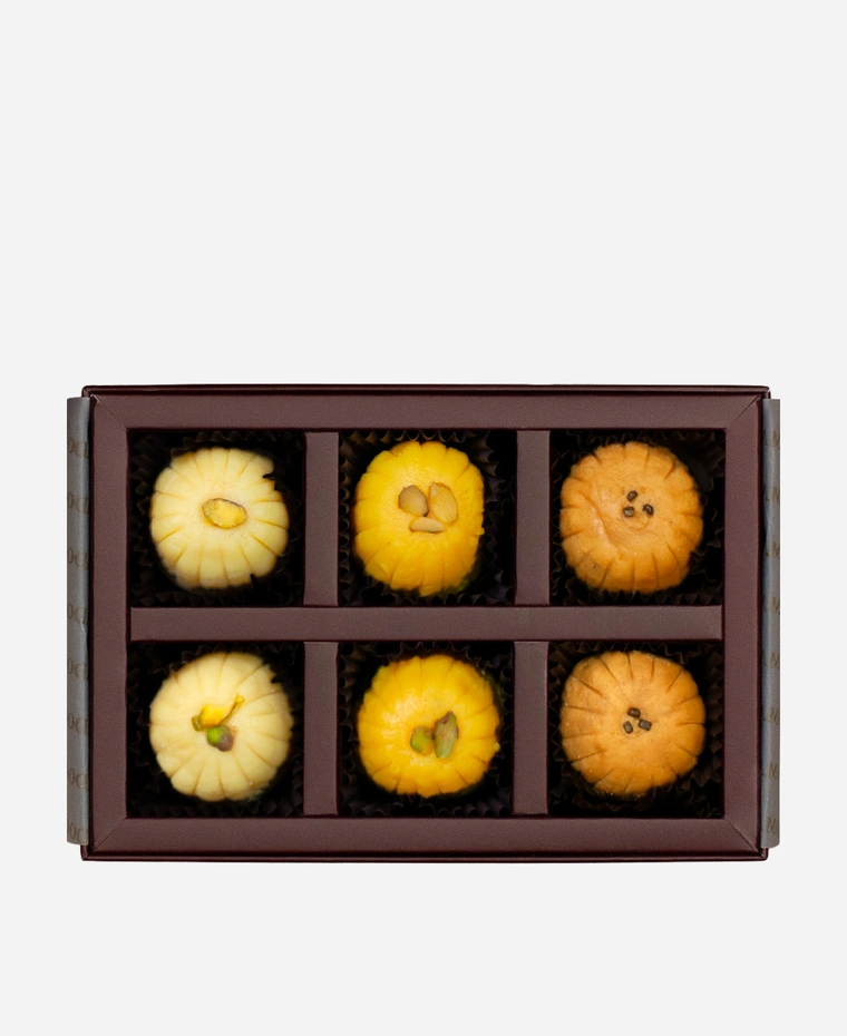 Signature Peda Selection gift box, 6 pieces, open: khoya, kesar and Mathura peda in a burgundy box with gold foil lettering.