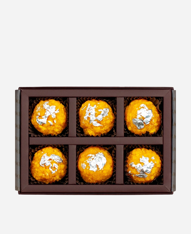 Silver Leaf Boondi Ladoo gift box, 6 pieces, open: golden boondi ladoo topped with edible silver leaf in a burgundy box with gold foil lettering.