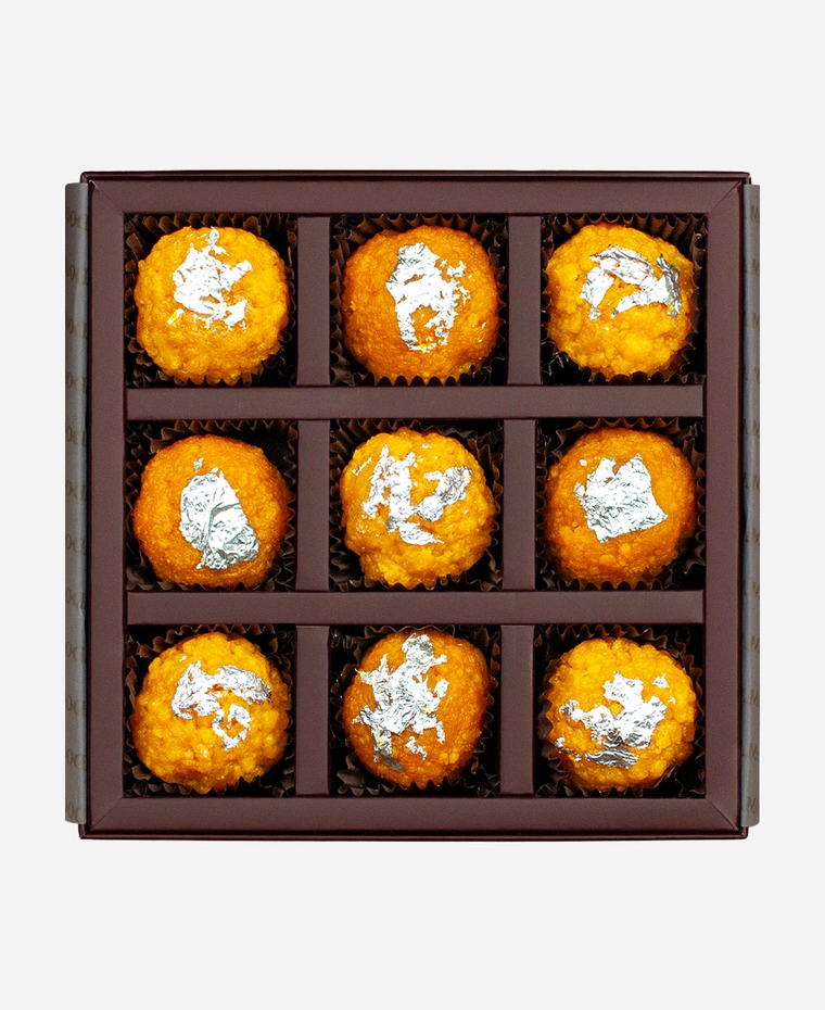Silver Leaf Ladoo Selection gift box, 9 pieces, open: boondi and motichoor ladoo topped with edible silver leaf in a burgundy box with gold foil lettering.