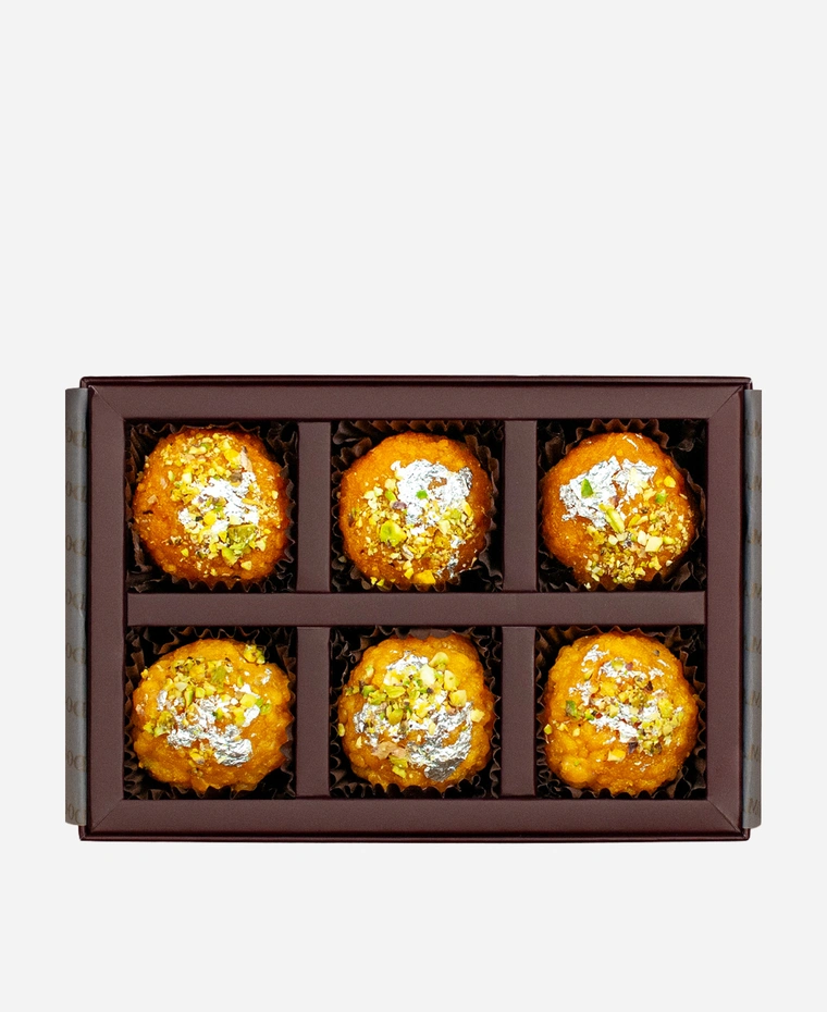 Silver Leaf & Pistachio Ladoo Selection gift box, 6 pieces, open: boondi and motichoor ladoo topped with edible silver leaf and chopped pistachio in a burgundy box with gold foil lettering.