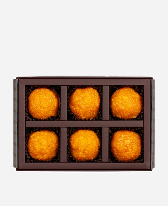 Classic Motichoor Ladoo gift box, 6 pieces, open: fine-grained motichoor ladoo in a burgundy box with gold foil lettering.