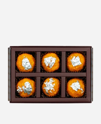 Silver Leaf Motichoor Ladoo gift box, 6 pieces, open: fine-grained motichoor ladoo topped with edible silver leaf in a burgundy box with gold foil lettering.