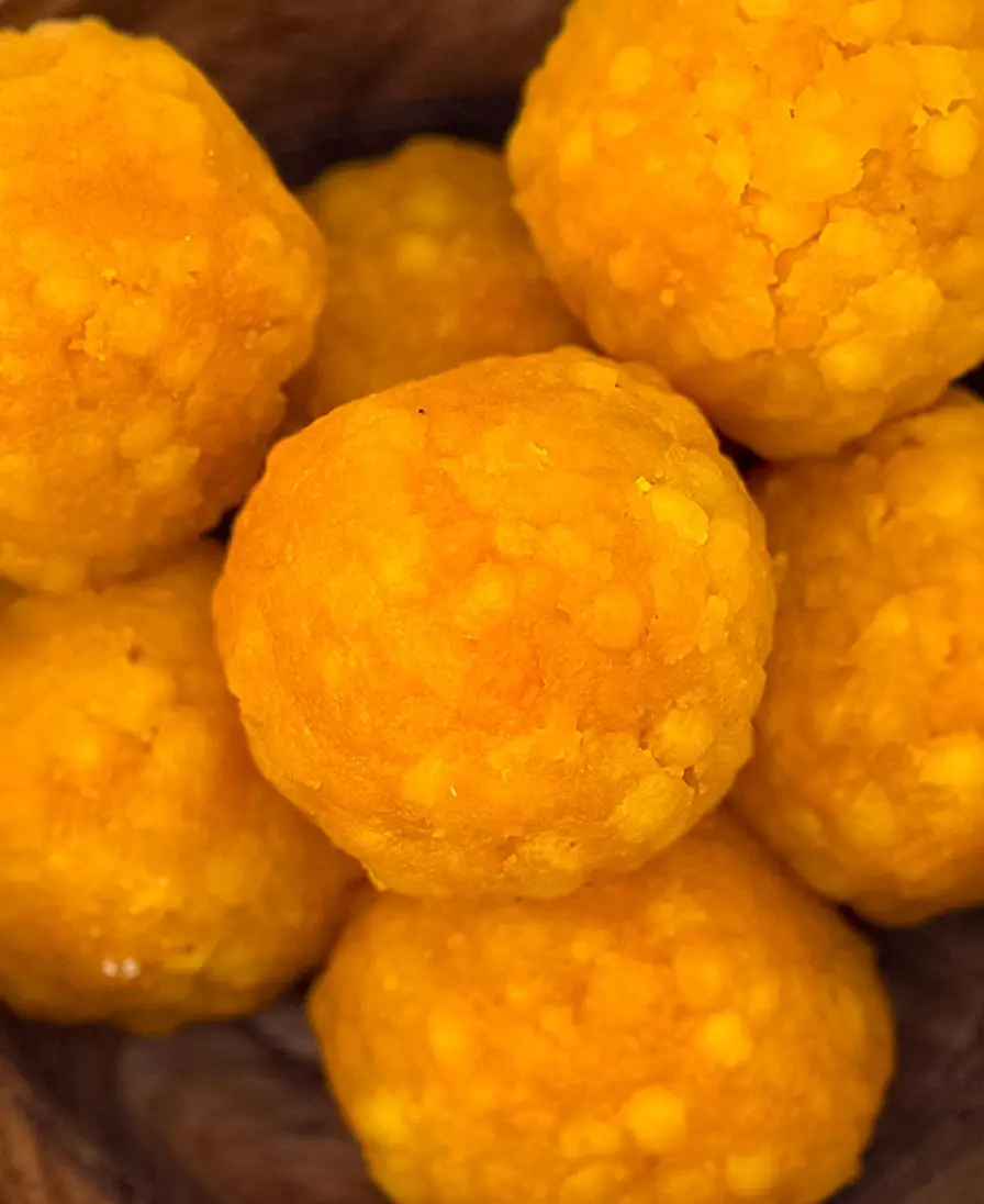 Classic boondi ladoo Close-up of handmade golden boondi ladoo, pearls of gram flour bound in syrup.