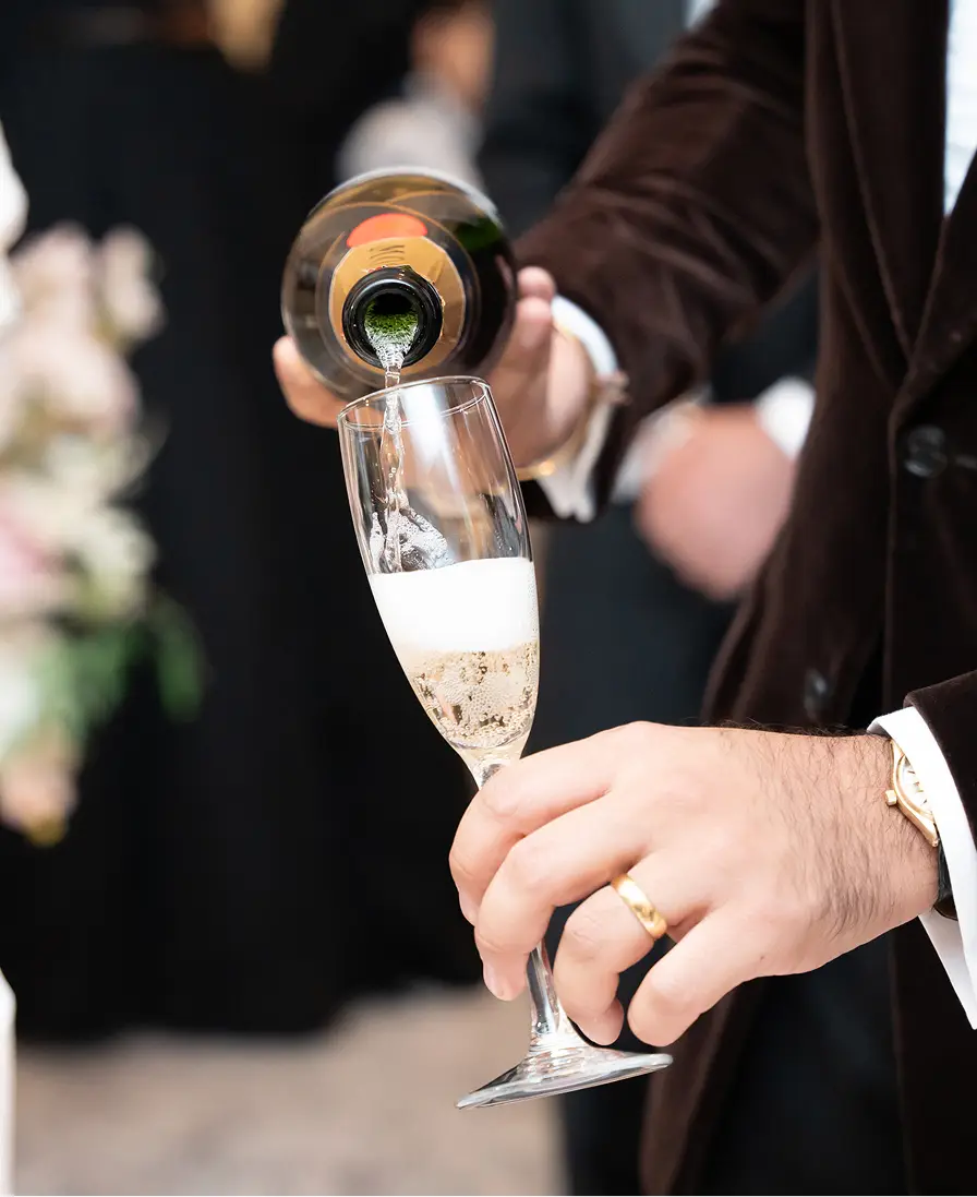 Champagne being poured at a wedding reception.